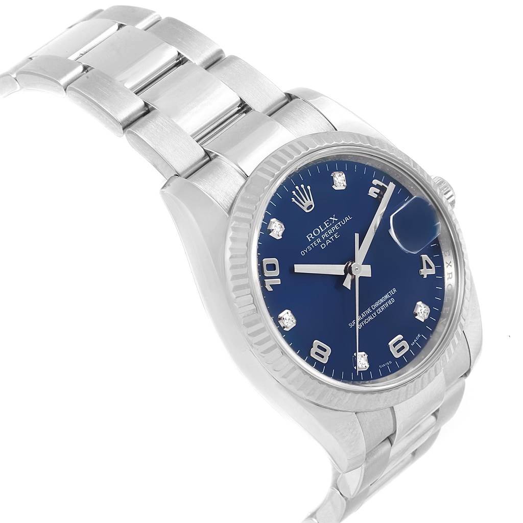The image shows a Rolex Date 115234 Men's Stainless Steel Blue Dial 115234 Men's Stainless Steel Blue Dial model watch at a three-quarter angle, highlighting the bracelet, bezel, dial, and crown.