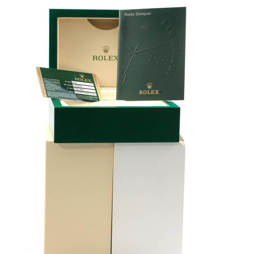 The image shows a Rolex Date 116200 Men's Stainless Steel Black Dial 116200 Men's Stainless Steel Black Dial model's box, warranty card, and manual from a front angle.