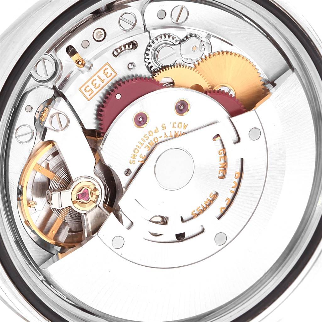 This close-up image displays the intricate internal movement of a Rolex Date 116200 Men's Stainless Steel Black Dial 116200 Men's Stainless Steel Black Dial model watch.