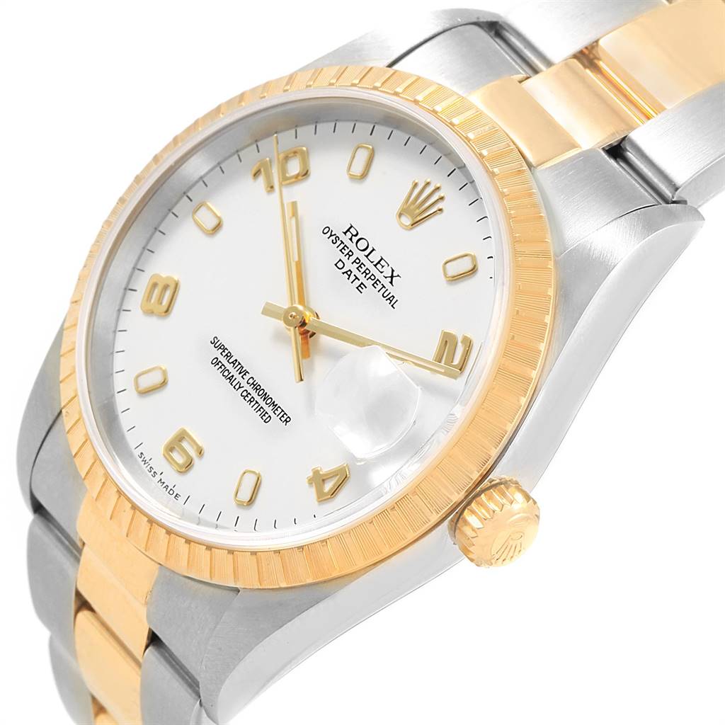 The image shows a Rolex Date 15223 Men's Steel and Gold (two tone) White Dial 15223 Men's Steel and Gold (two tone) White Dial model watch from an angled top view, highlighting the dial, bezel, crown, and part of the bracelet.