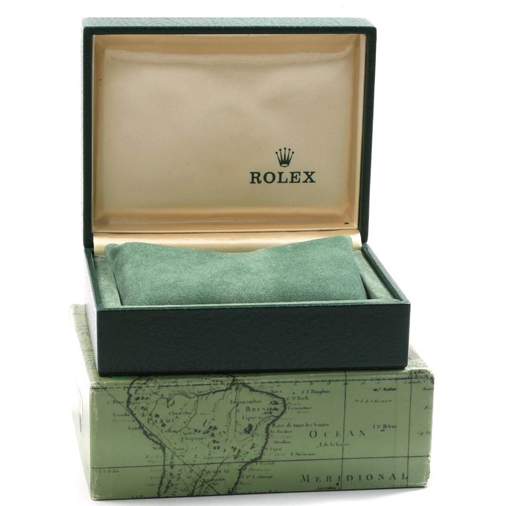 The image shows an open Rolex watch box for the Date model, displaying the interior cushion and the brand logo.