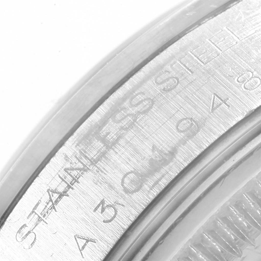 This image shows a close-up of the Rolex Date 15200 Men's Stainless Steel White Dial 15200 Men's Stainless Steel White Dial model's stainless steel case with engraved markings.