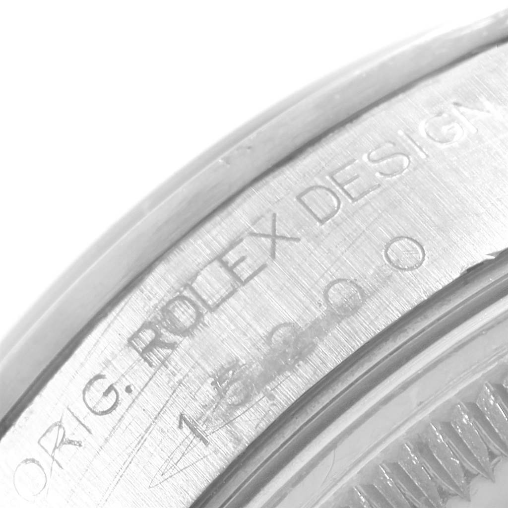 This close-up angle shows the engraved text on the side of a Rolex Date 15200 Men's Stainless Steel White Dial 15200 Men's Stainless Steel White Dial watch bezel.