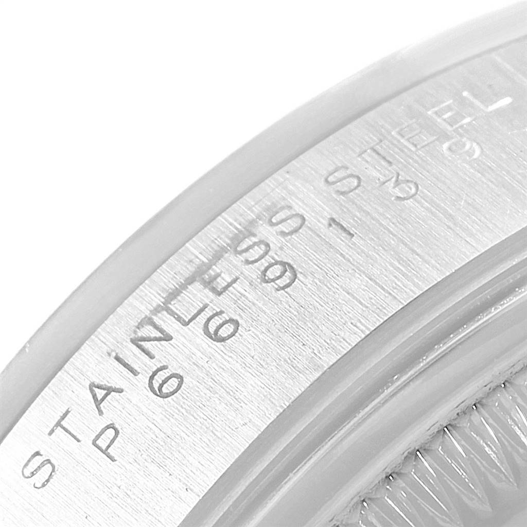 The image shows a close-up of the inner bezel and case engravings of a Rolex Date 15200 Men's Stainless Steel Silver Dial 15200 Men's Stainless Steel Silver Dial model watch.