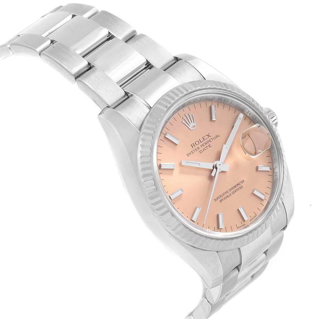 The image shows a side angle of the Rolex Date 115234 Stainless Steel Pink Dial 115234 Stainless Steel Pink Dial model watch, displaying its face, bezel, and part of the bracelet.