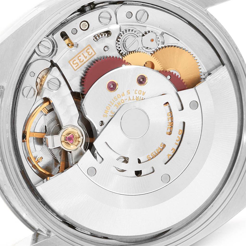 This image shows the intricate internal movement of a Rolex Date 115234 Stainless Steel Pink Dial 115234 Stainless Steel Pink Dial model watch.