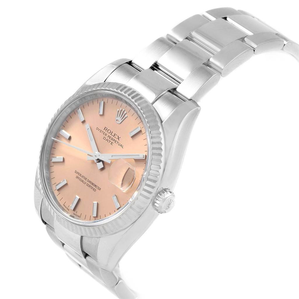 This image shows a right-side angle of the Rolex Date 115234 Stainless Steel Pink Dial 115234 Stainless Steel Pink Dial model, highlighting the dial, bezel, crown, and part of the bracelet.