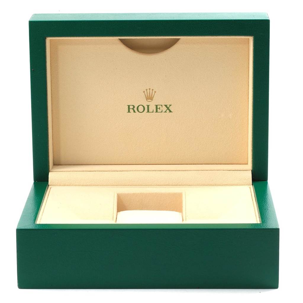 The image shows an open green and beige Rolex watch box for the Rolex Date 115234 Stainless Steel Pink Dial 115234 Stainless Steel Pink Dial model.