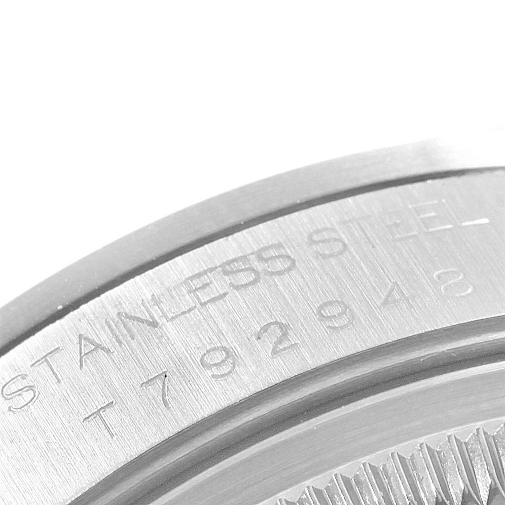 This is a close-up view of the case back engraving on a Rolex Date 15200 Men's Stainless Steel Silver Dial 15200 Men's Stainless Steel Silver Dial model watch, showing the stainless steel material.
