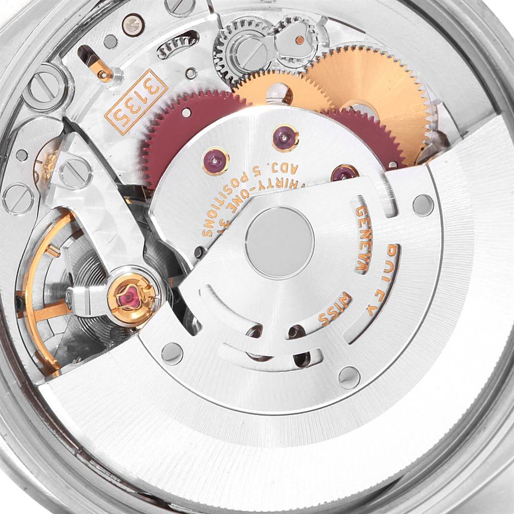 The image shows the movement and internal components of a Rolex Date 115200 Men's Stainless Steel Black Dial 115200 Men's Stainless Steel Black Dial model watch, viewed from the back.