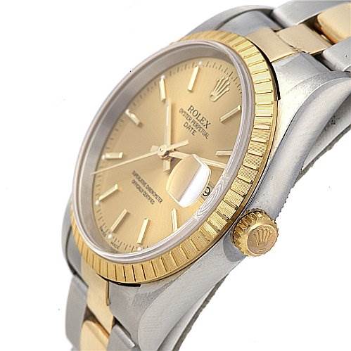The image shows a side and slightly angled view of the Rolex Date 15223 Men's Stainless Steel Champagne Dial 15223 Men's Stainless Steel Champagne Dial watch, highlighting its bezel, crown, and part of the strap.