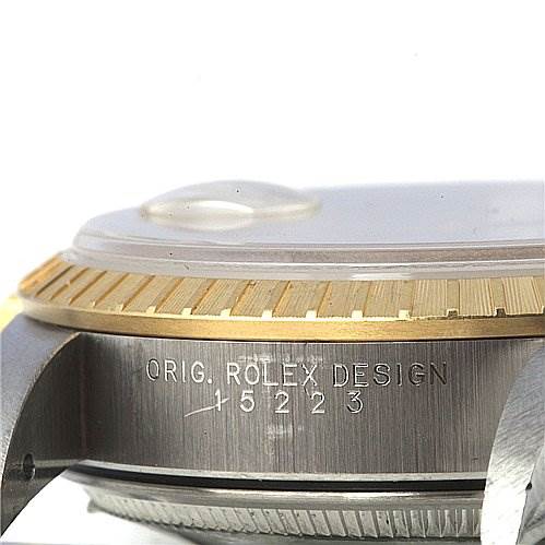 The image shows a close-up side angle of the Rolex Date 15223 Men's Stainless Steel Champagne Dial 15223 Men's Stainless Steel Champagne Dial model watch, highlighting the bezel and part of the case with the model number.