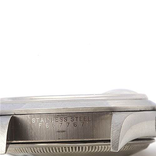 The image shows a side view of the stainless steel case of a Rolex Date 15200 Men's Stainless Steel White Dial 15200 Men's Stainless Steel White Dial model, displaying part of the serial number and watch bezel.