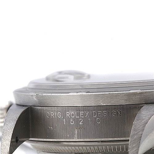 This is a close-up side view of the case of a Rolex Date 15210 Men's Stainless Steel Black Dial 15210 Men's Stainless Steel Black Dial model with the inscription "ORIG. ROLEX DESIGN 15210."