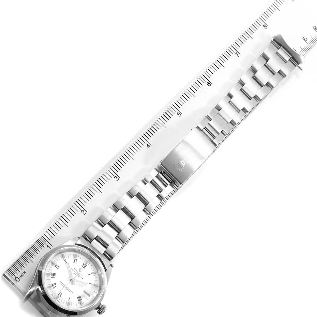 The image shows a top-down view of a Rolex Date 15200 Men's Stainless Steel White Dial 15200 Men's Stainless Steel White Dial watch, displaying the dial, bracelet, and clasp alongside a ruler.