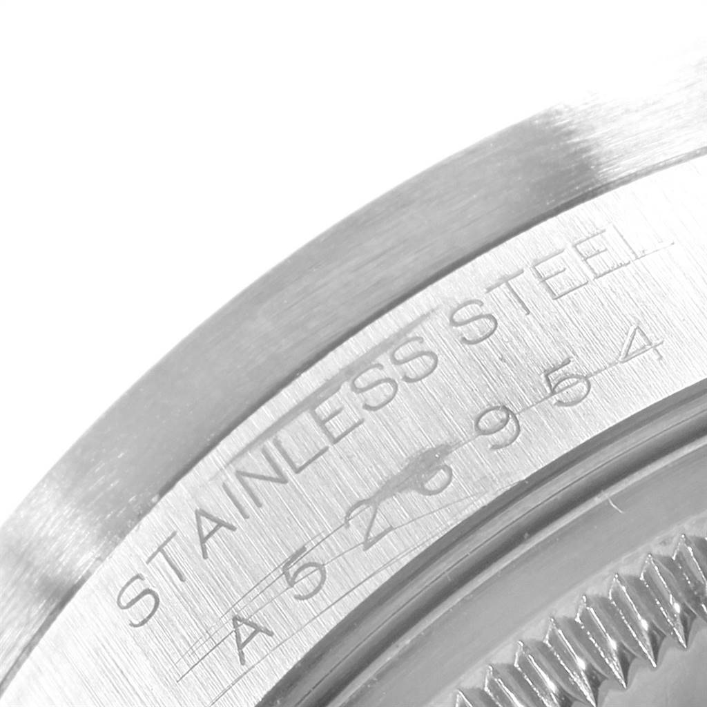 This image shows a close-up of the stainless steel case back and edge engraving of the Rolex Date 15210 Men's Stainless Steel Silver Dial 15210 Men's Stainless Steel Silver Dial model watch.
