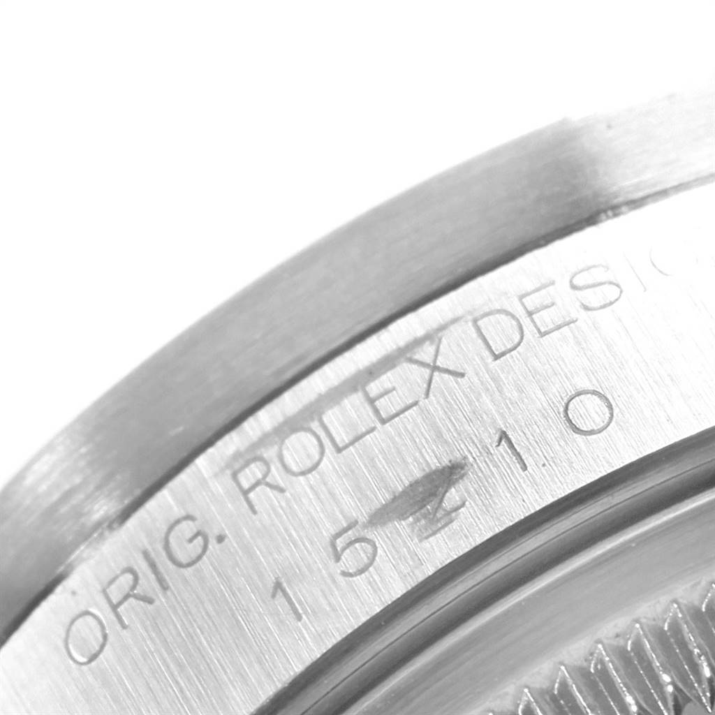 This image shows a close-up of the case side and engraving of a Rolex Date 15210 Men's Stainless Steel Silver Dial 15210 Men's Stainless Steel Silver Dial model watch.