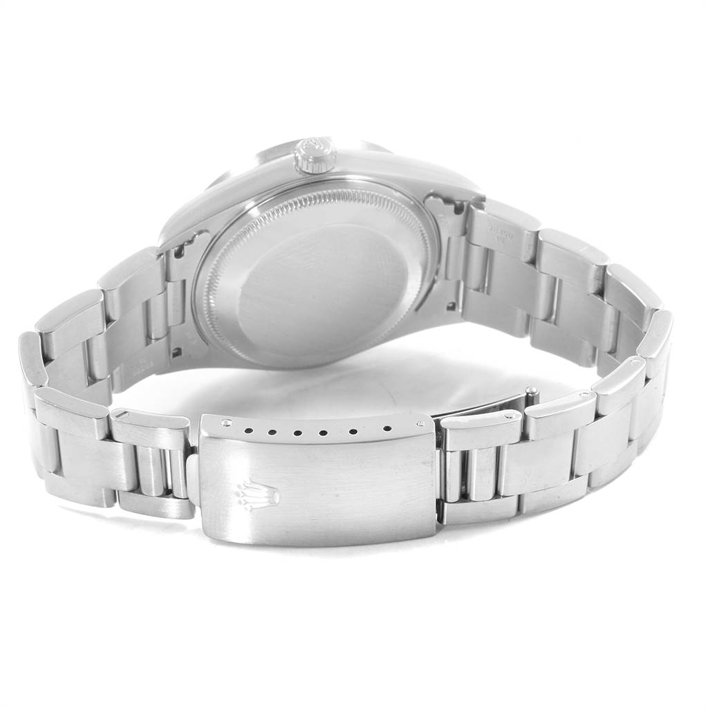 This image shows the back case, crown, and bracelet clasp of a Rolex Date 15210 Men's Stainless Steel Silver Dial 15210 Men's Stainless Steel Silver Dial model watch.