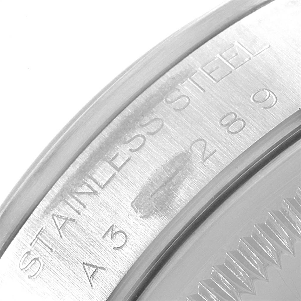 The image shows a close-up of the engraving on the stainless steel back of a Rolex Date 15200 Men's Stainless Steel Black Dial 15200 Men's Stainless Steel Black Dial model watch.
