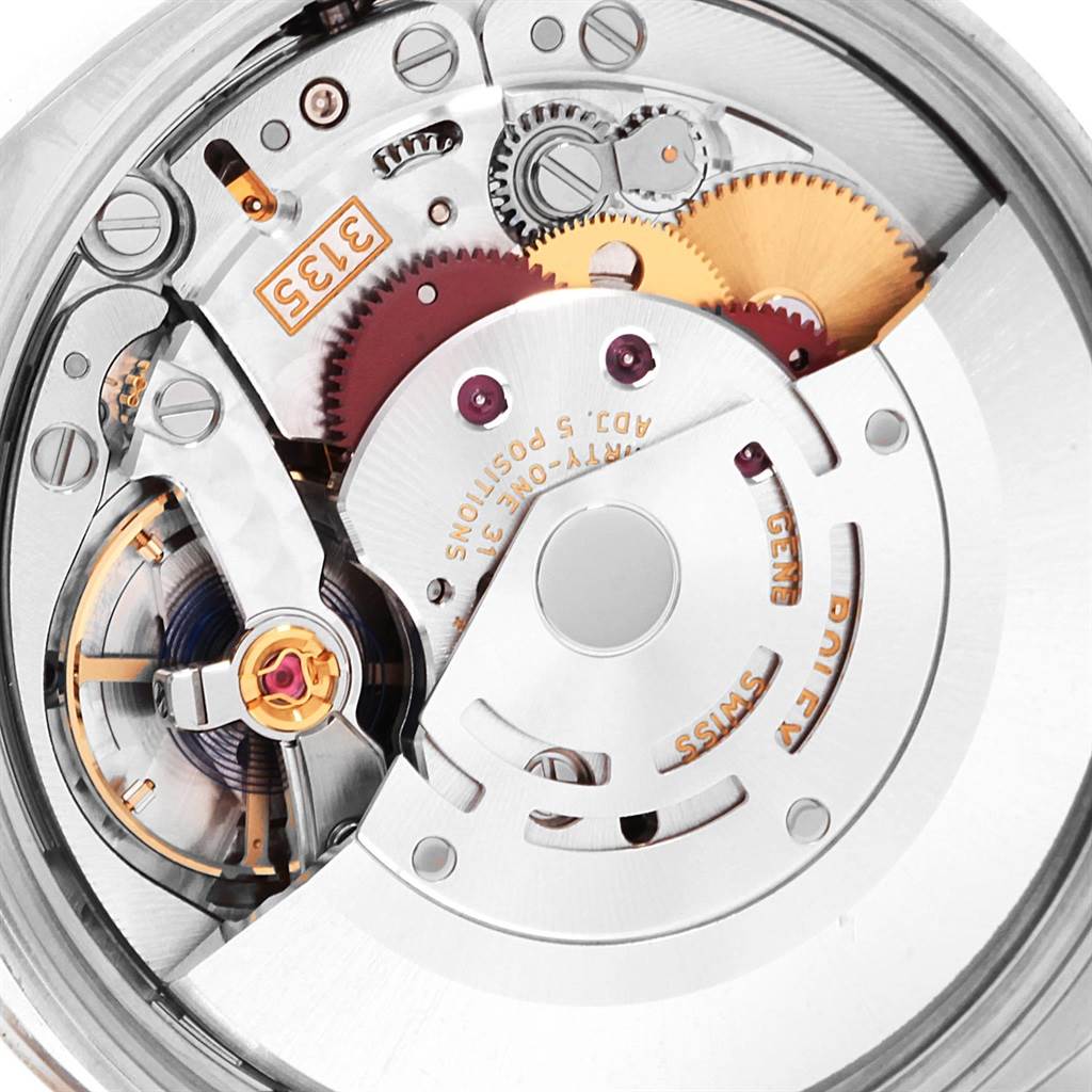 This image shows the intricate interior mechanism and movement of a Rolex Date 115234 Men's Stainless Steel Silver Dial 115234 Men's Stainless Steel Silver Dial model watch from a close-up angle.