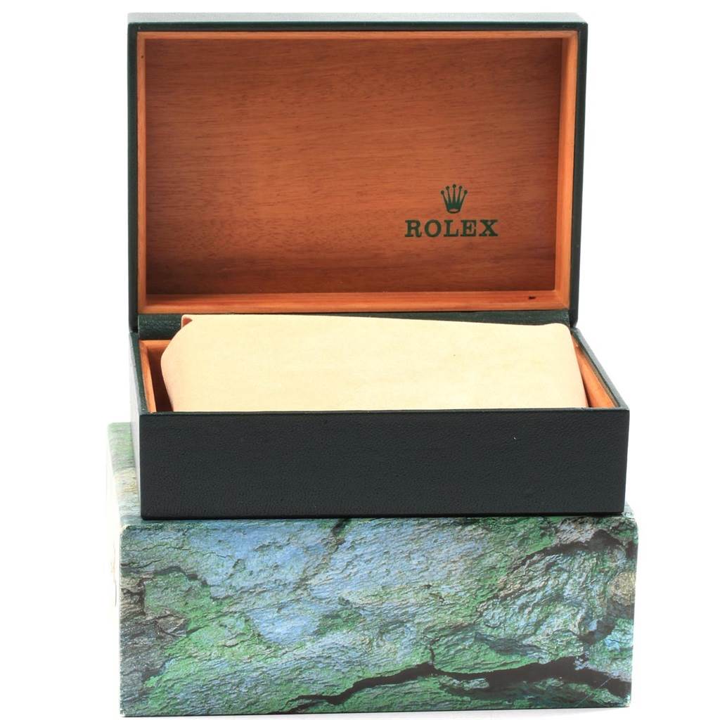 The image shows an open Rolex box with a cushion inside, but the Rolex Date 15210 Men's Stainless Steel Blue Dial 15210 Men's Stainless Steel Blue Dial watch itself is not visible.