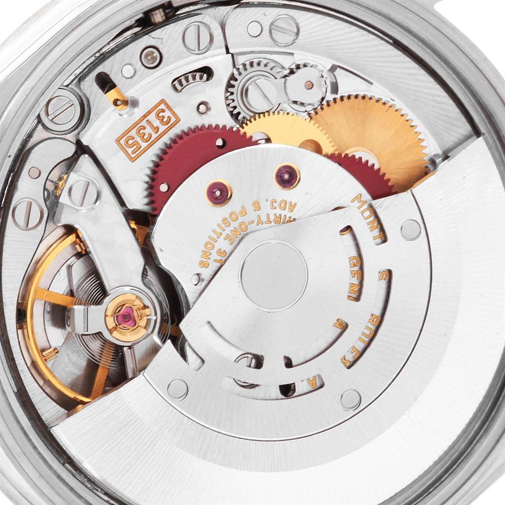 This is a close-up view of the internal mechanism of a Rolex Date 15210 Men's Stainless Steel Blue Dial 15210 Men's Stainless Steel Blue Dial model watch, showing the intricate gears and rotor.