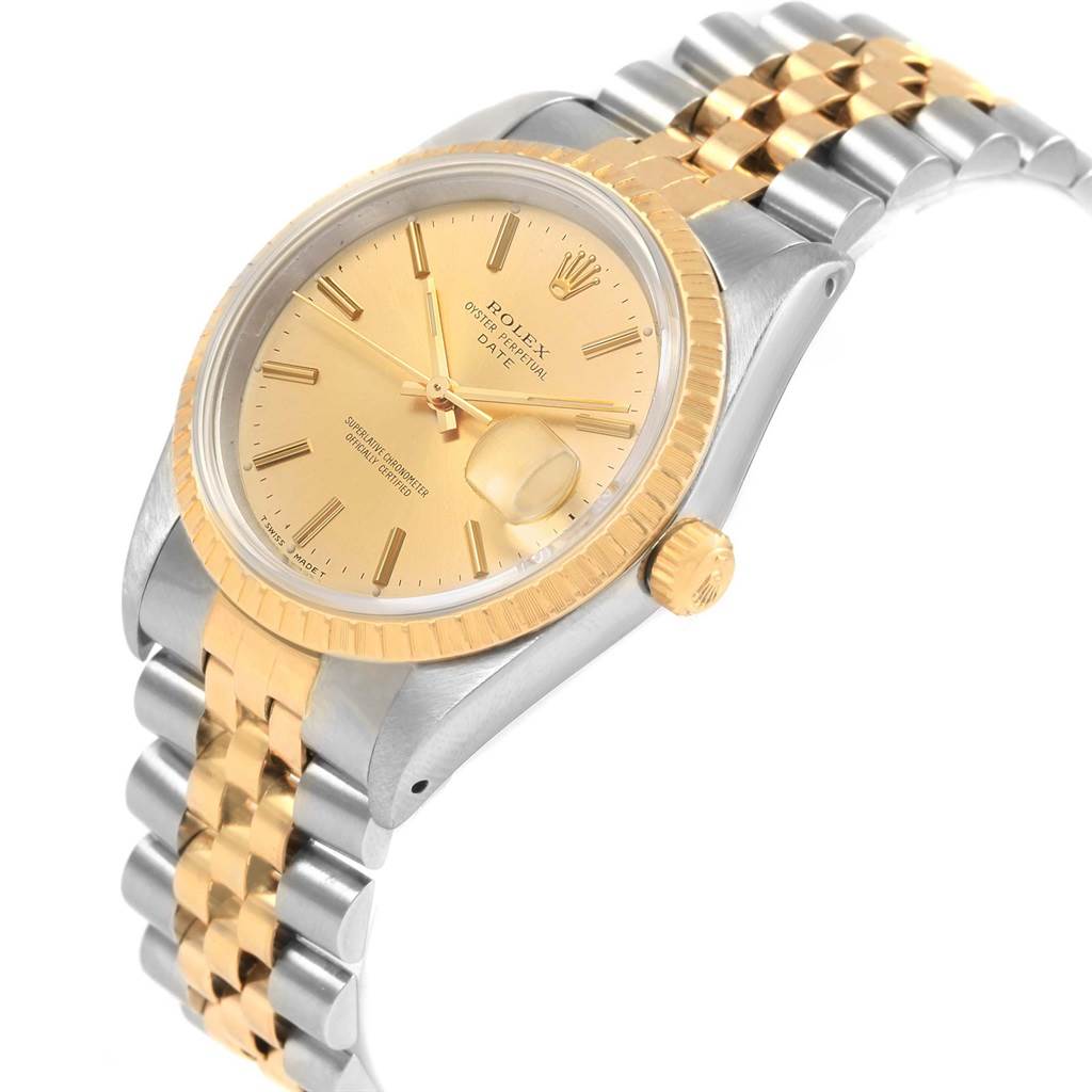 This Rolex Date 15223 Men's Steel and Gold (two tone) Champagne Dial 15223 Men's Steel and Gold (two tone) Champagne Dial model is shown at an angled view, highlighting the two-tone bracelet, gold bezel, crown, and champagne dial.