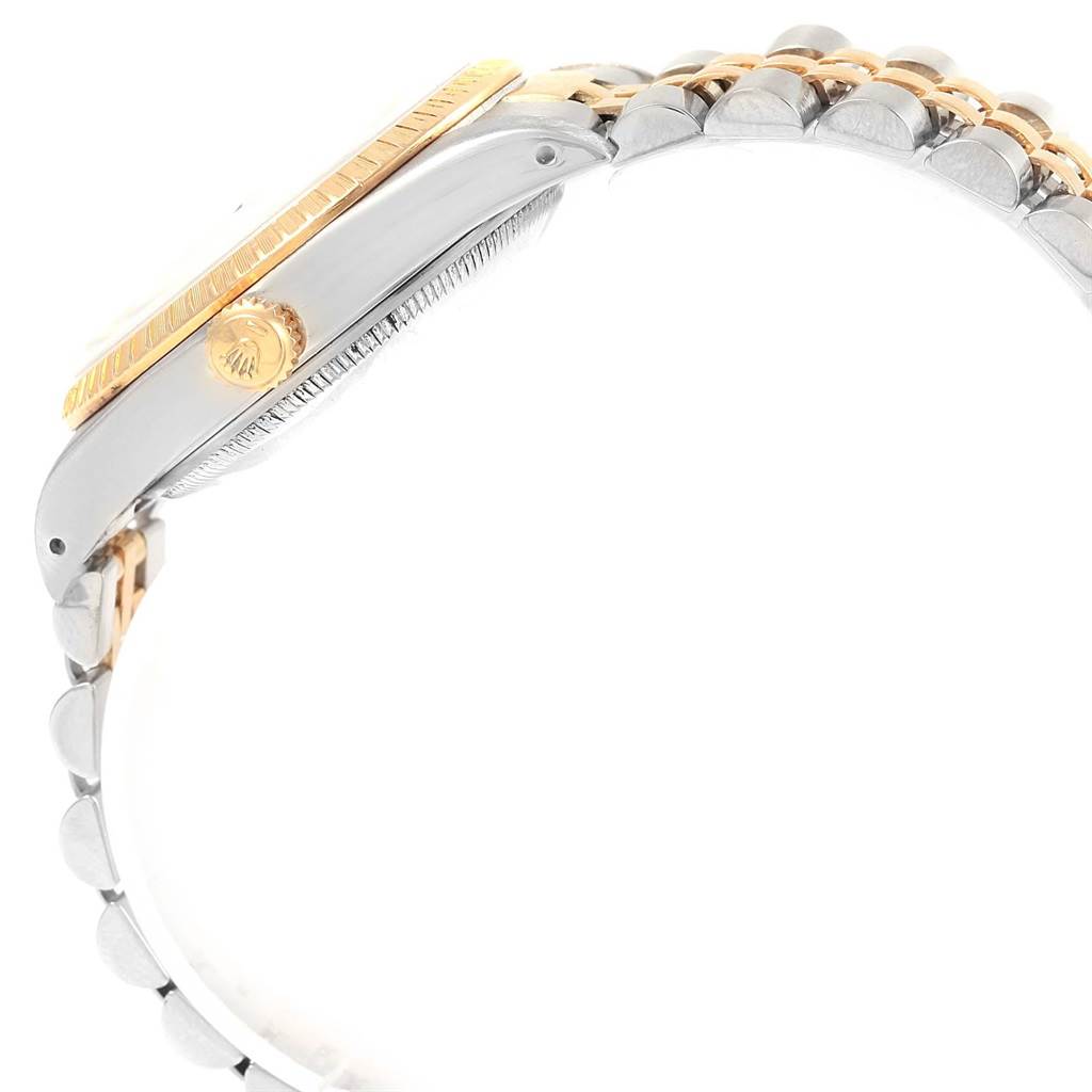 This side view of a Rolex Date 15223 Men's Steel and Gold (two tone) Champagne Dial 15223 Men's Steel and Gold (two tone) Champagne Dial model watch showcases the crown, bezel, and part of the bracelet.