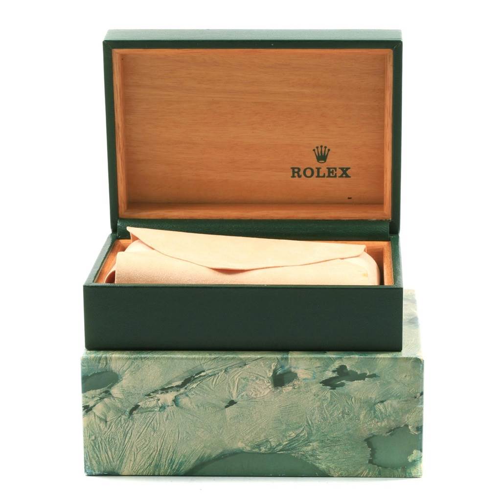 This image shows an open green Rolex Date 15223 Men's Steel and Gold (two tone) Champagne Dial 15223 Men's Steel and Gold (two tone) Champagne Dial model watch box with an inner tan pouch, viewed from the front.