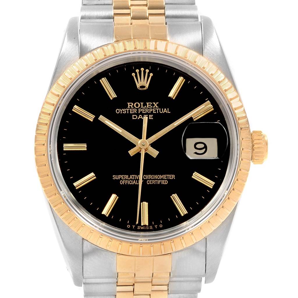 The Rolex Date 15223 Men's Steel and Gold (two tone) Black Dial 15223 Men's Steel and Gold (two tone) Black Dial watch is shown from a front angle, displaying the dial, bezel, crown, and part of the bracelet.