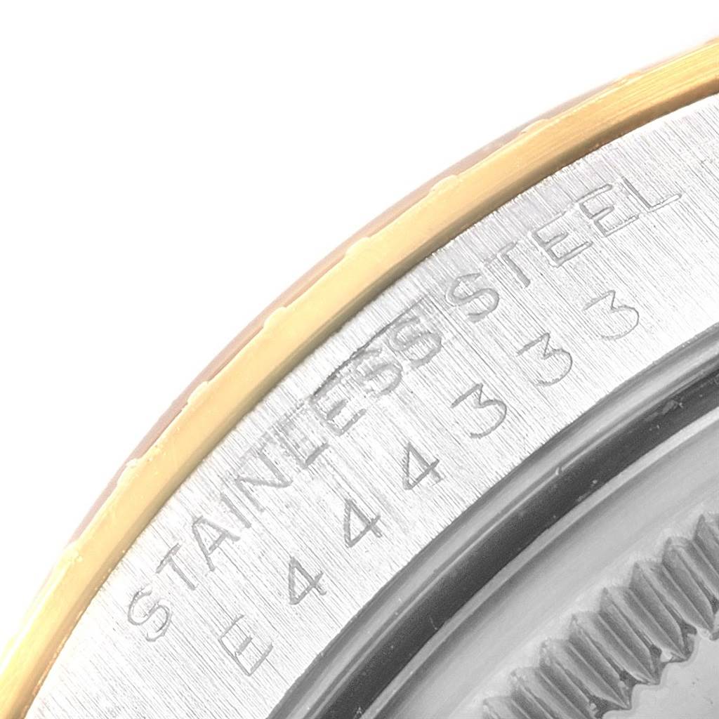The image shows a close-up of the rehaut and part of the bezel with text engraving on a stainless steel Rolex Date 15223 Men's Steel and Gold (two tone) Black Dial 15223 Men's Steel and Gold (two tone) Black Dial watch.