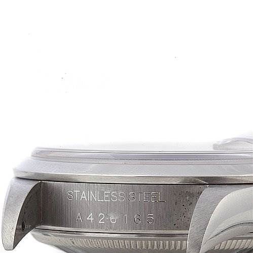 This image shows a close-up side view of the stainless steel casing and engraved serial number of a Rolex Date 15200 Men's Stainless Steel Brown Dial 15200 Men's Stainless Steel Brown Dial model watch.