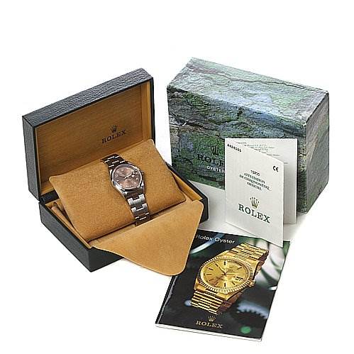 The image shows a Rolex Date 15200 Men's Stainless Steel Brown Dial 15200 Men's Stainless Steel Brown Dial watch in its box, along with the outer Rolex box, instruction manual, and certification papers.