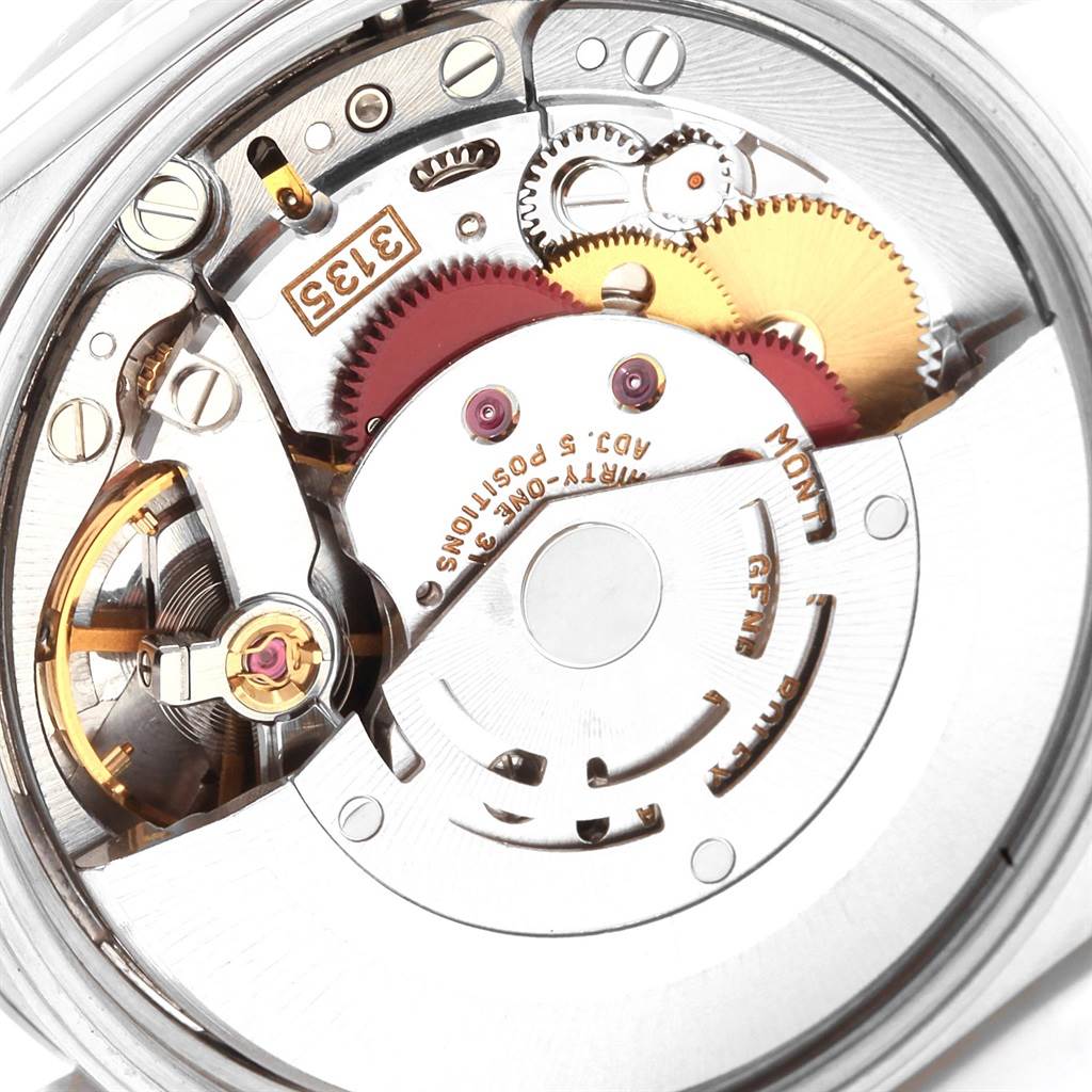 This image shows the intricate inner mechanism of a Rolex Date 15200 Men's Stainless Steel White Dial 15200 Men's Stainless Steel White Dial model watch from a close-up angle, highlighting gears and components.