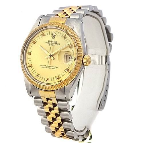 This image shows a Rolex Date 15053 Men's Stainless Steel Champagne Dial 15053 Men's Stainless Steel Champagne Dial model watch at an oblique angle, highlighting its yellow gold and stainless steel bracelet and fluted bezel.
