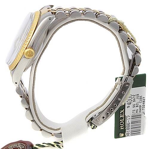 This image shows a side profile of a Rolex Date 15053 Men's Stainless Steel Champagne Dial 15053 Men's Stainless Steel Champagne Dial model watch, highlighting its gold bezel, two-tone bracelet, and tags.