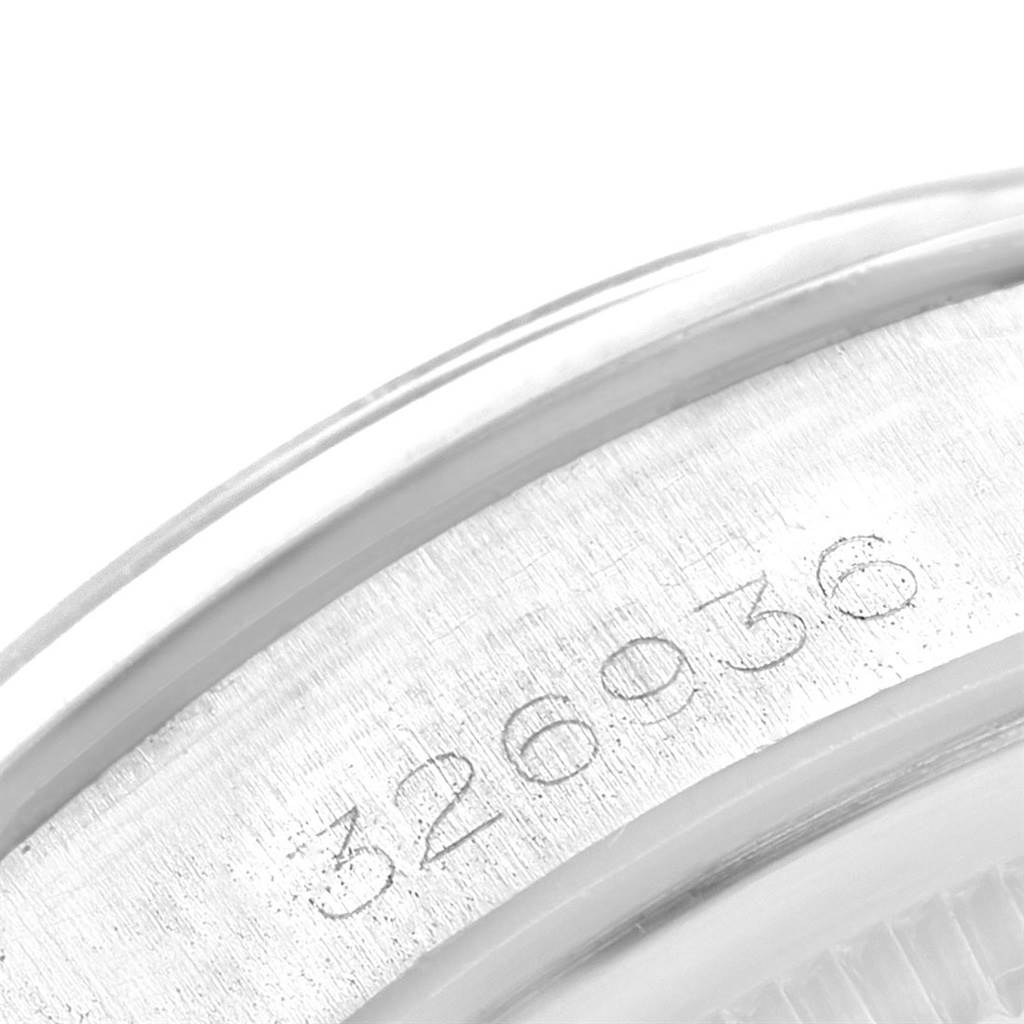 This image shows a close-up of the case back engraving on a Rolex Date 1500 Men's Stainless Steel Blue Dial 1500 Men's Stainless Steel Blue Dial model watch, displaying part of the serial number.