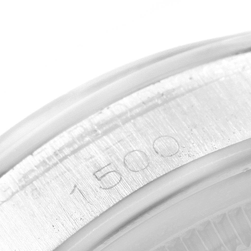 The image shows a close-up view of the serial number engraved on the case of a Rolex Date 1500 Men's Stainless Steel Blue Dial 1500 Men's Stainless Steel Blue Dial watch.