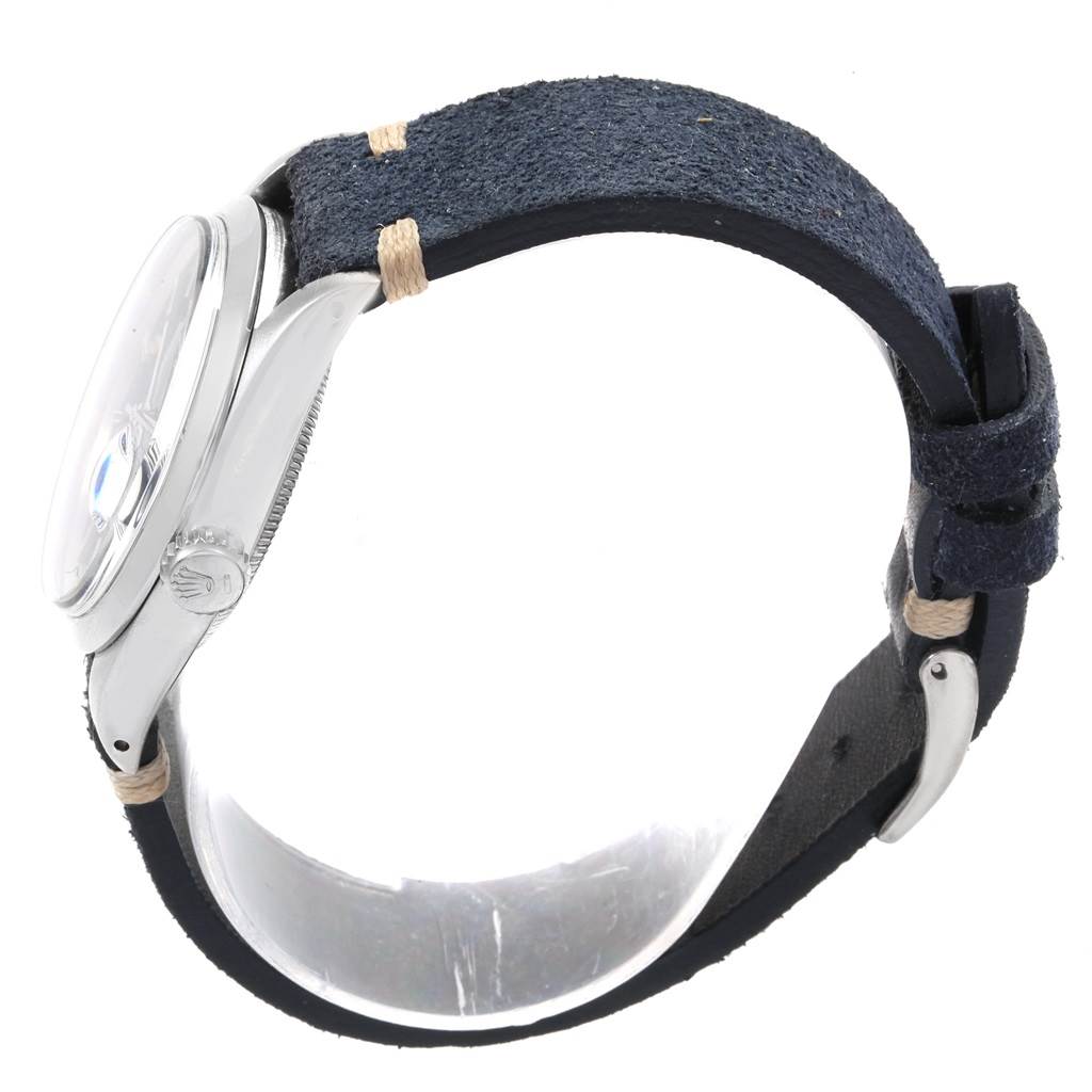 The image shows a side view of a Rolex Date 1500 Men's Stainless Steel Blue Dial 1500 Men's Stainless Steel Blue Dial model watch featuring a leather strap and stainless steel case.