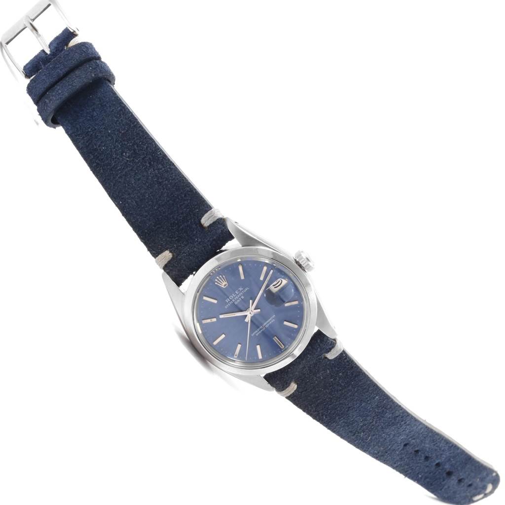 This image shows a Rolex Date 1500 Men's Stainless Steel Blue Dial 1500 Men's Stainless Steel Blue Dial model watch from a high angle, highlighting the blue dial, bezel, case, crown, and leather strap.