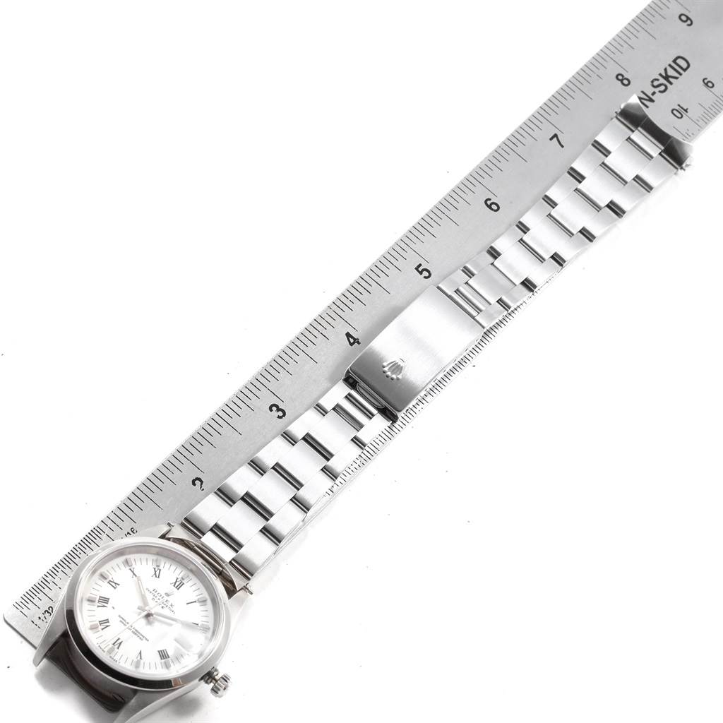 The image shows a Rolex Date 15200 Men's Stainless Steel White Dial 15200 Men's Stainless Steel White Dial model watch from an aerial view, displaying the face, bracelet, and part of the clasp.