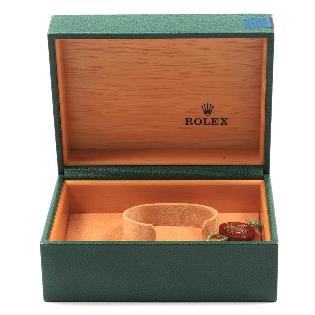 The image shows an open Rolex Date 15200 Men's Stainless Steel Silver Dial 15200 Men's Stainless Steel Silver Dial model watch box with a green exterior and wooden interior.