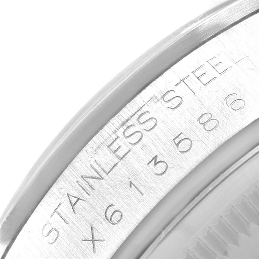 This close-up image of the Rolex Date 15200 Men's Stainless Steel Silver Dial 15200 Men's Stainless Steel Silver Dial model showcases the engraved "STAINLESS STEEL" on the case.