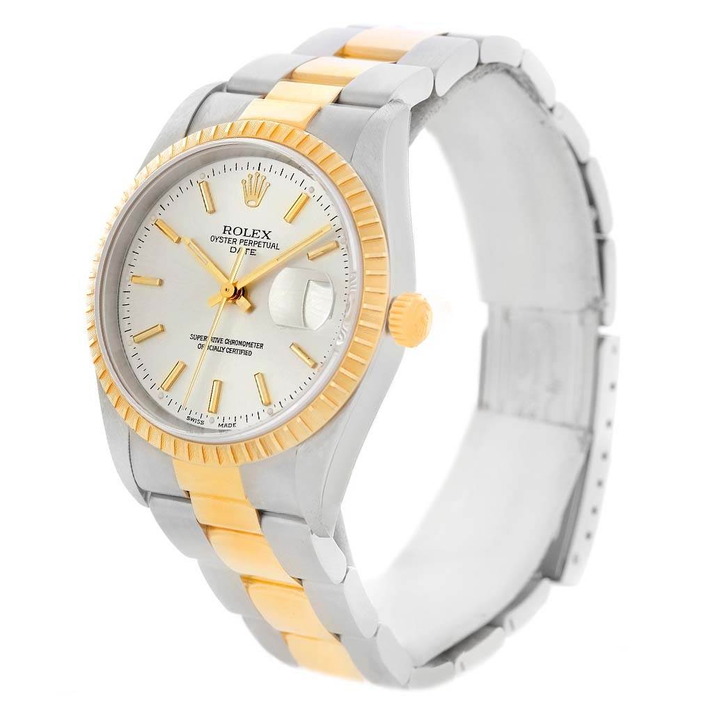 The Rolex Date 15223 Men's Steel and Gold (two tone) Silver Dial 15223 Men's Steel and Gold (two tone) Silver Dial model watch is shown at a three-quarter angle, highlighting the dial, bezel, crown, and bracelet.