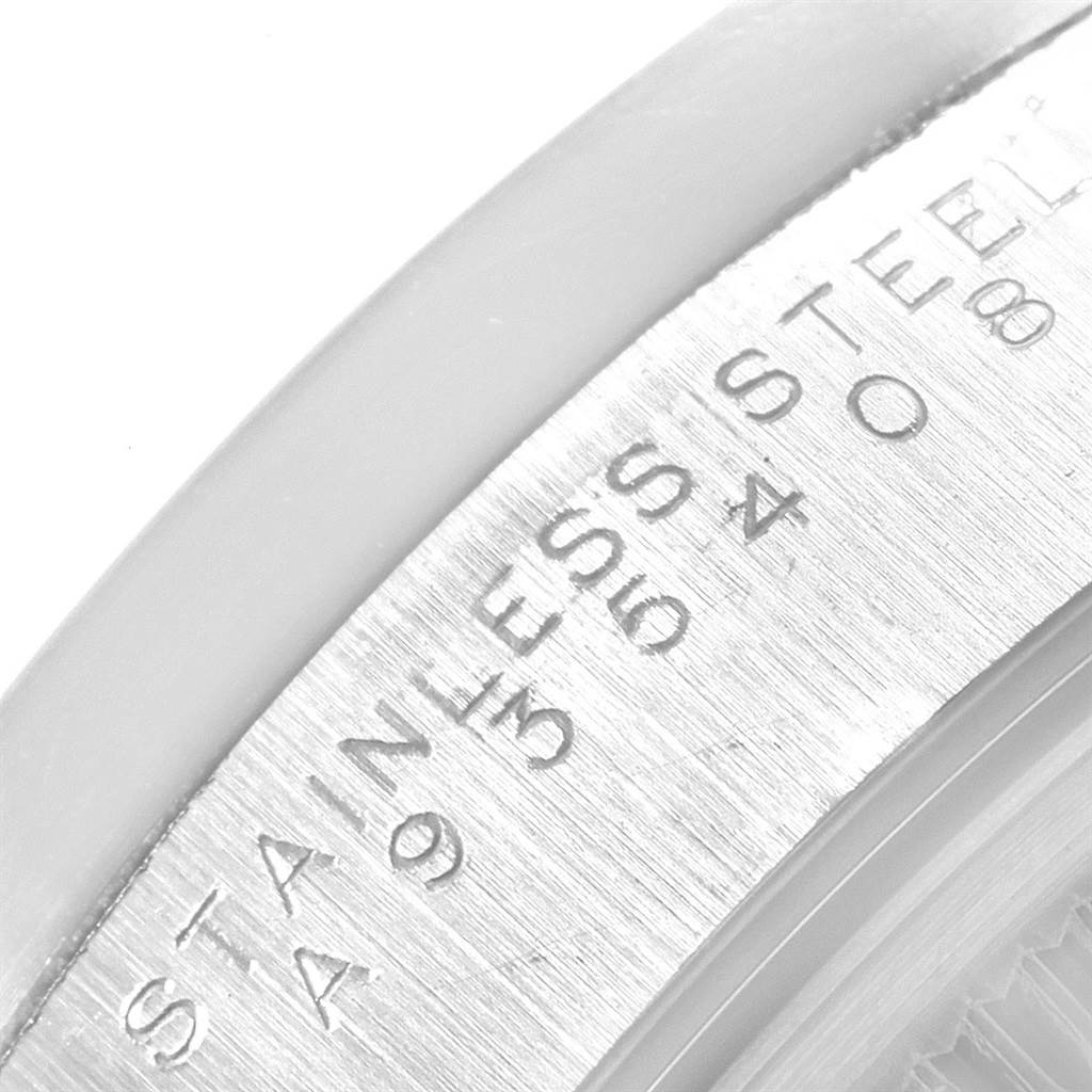 The image shows a close-up of the stainless steel case back with engravings of the Rolex Date 15210 Men's Stainless Steel White Dial 15210 Men's Stainless Steel White Dial model.