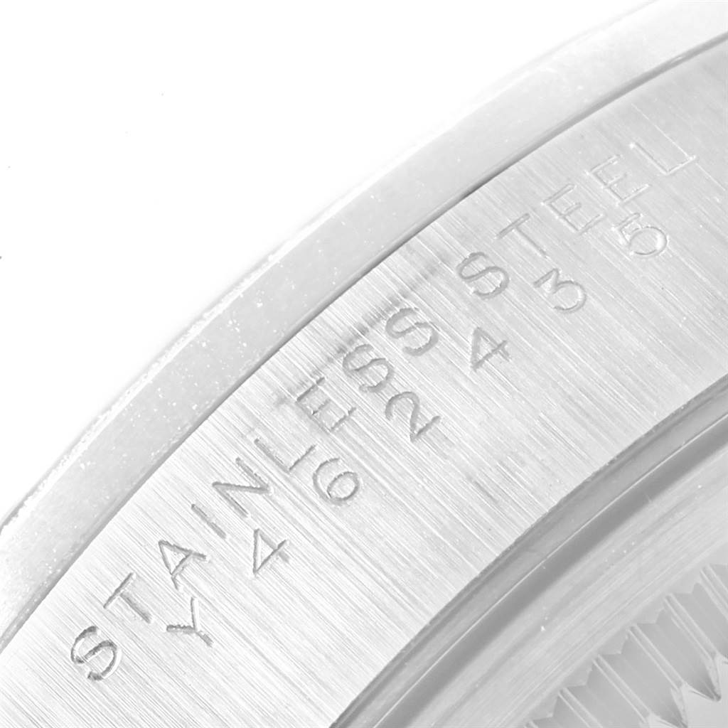 This close-up image of the Rolex Date 15200 Men's Stainless Steel Black Dial 15200 Men's Stainless Steel Black Dial watch shows the side case with "STAINLESS STEEL" engraved on it.