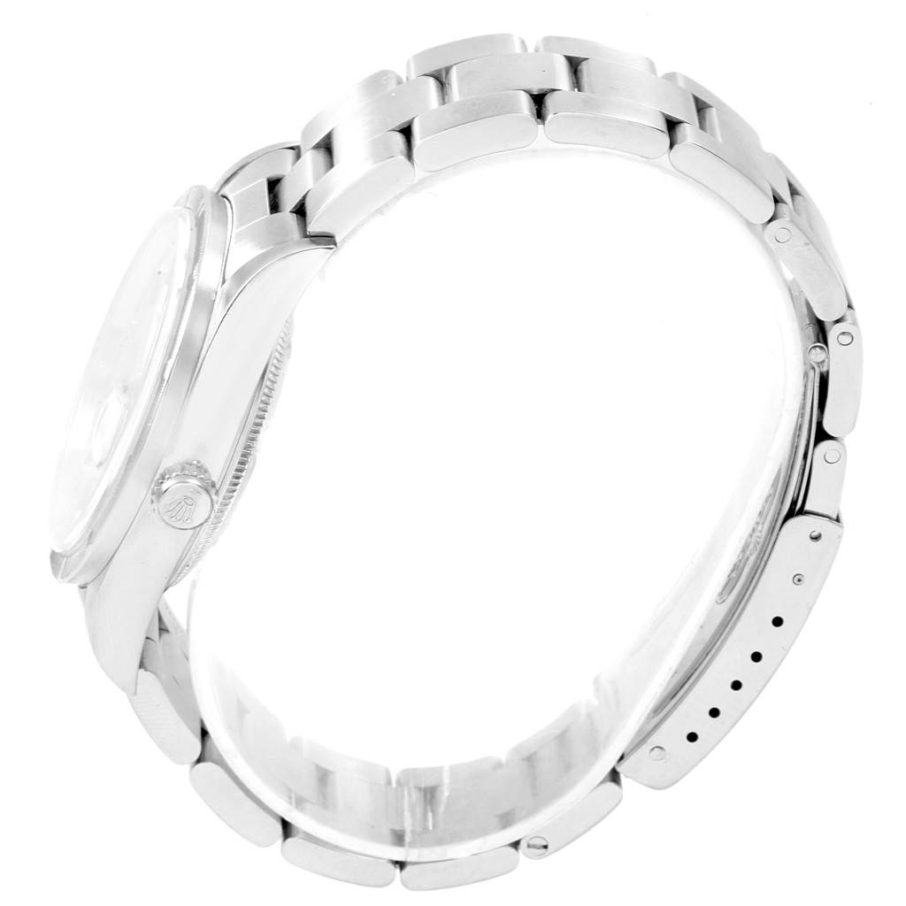 The image shows a side view of a Rolex Date 15210 Men's Stainless Steel Silver Dial 15210 Men's Stainless Steel Silver Dial model watch, highlighting its band, case, and crown.