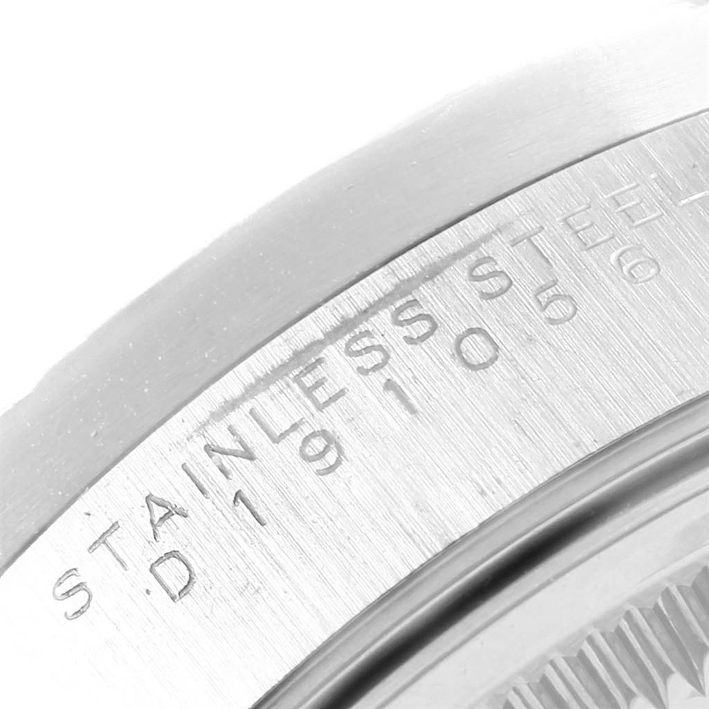 The image shows a close-up of the case back edge and engraving of the Rolex Date 15210 Men's Stainless Steel Silver Dial 15210 Men's Stainless Steel Silver Dial model watch, highlighting the "STAINLESS STEEL" text.