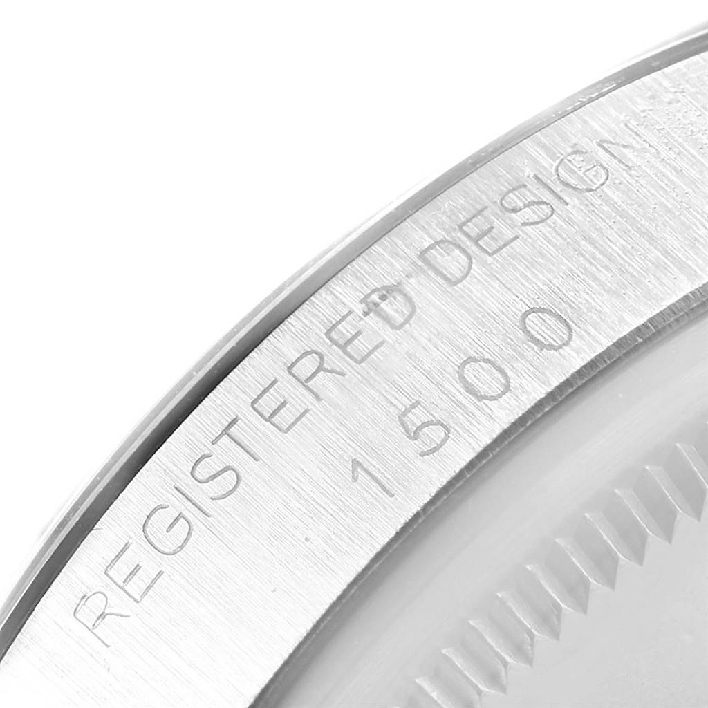 This close-up angle shows the engraved case back of the Rolex Date 1500 Men's Stainless Steel Silver Dial 1500 Men's Stainless Steel Silver Dial model, displaying "REGISTERED DESIGN 1500".
