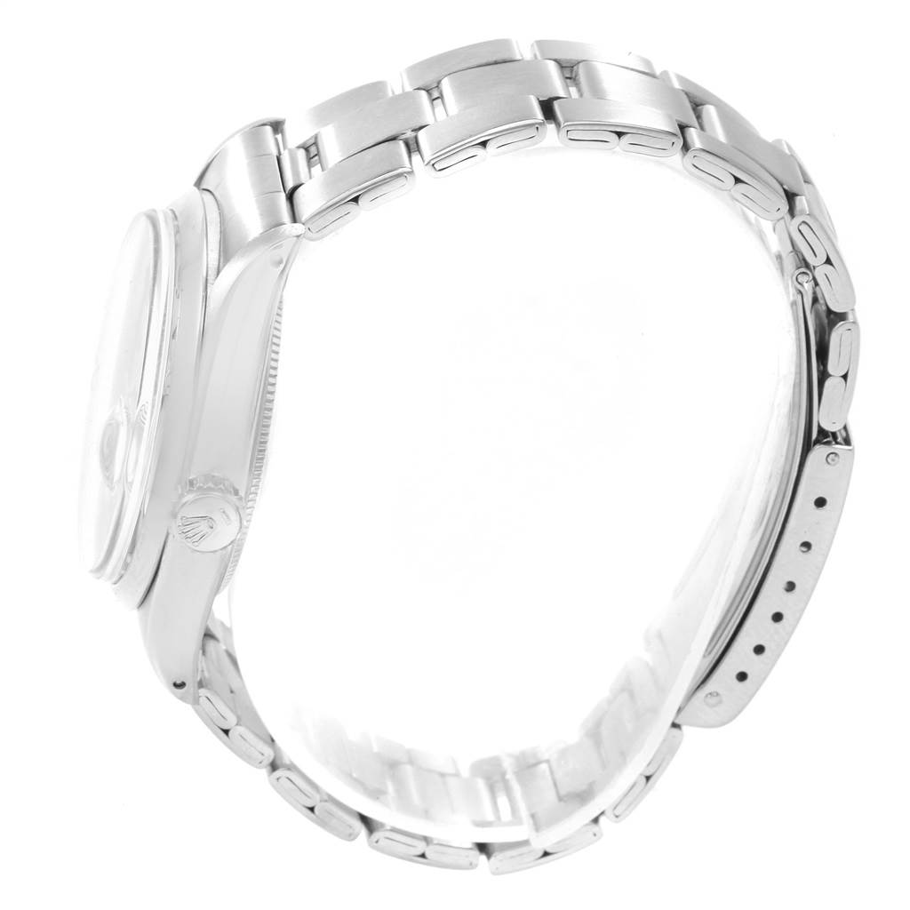 The image shows the side angle of a Rolex Date 1500 Men's Stainless Steel Silver Dial 1500 Men's Stainless Steel Silver Dial model watch, highlighting the case, crown, and bracelet.